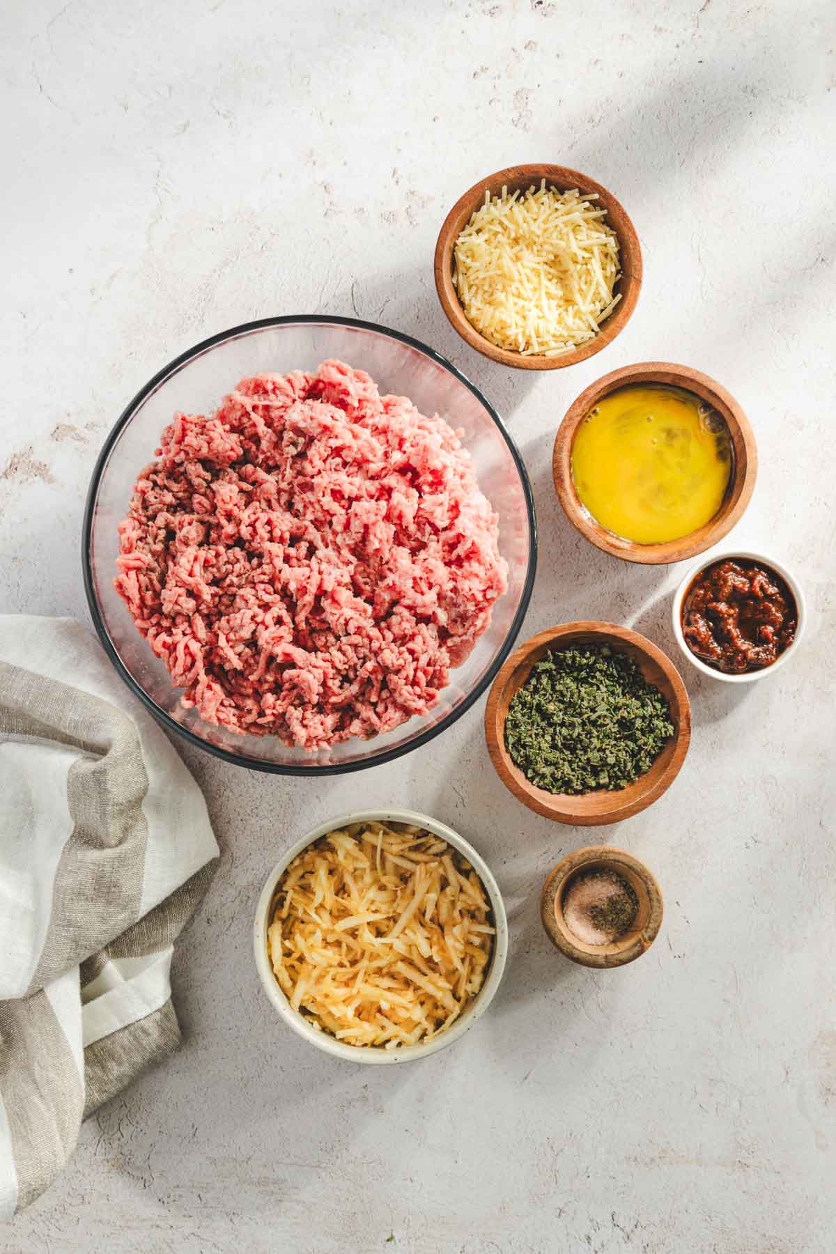 ingredients for apple sage meatballs, apples are shredded