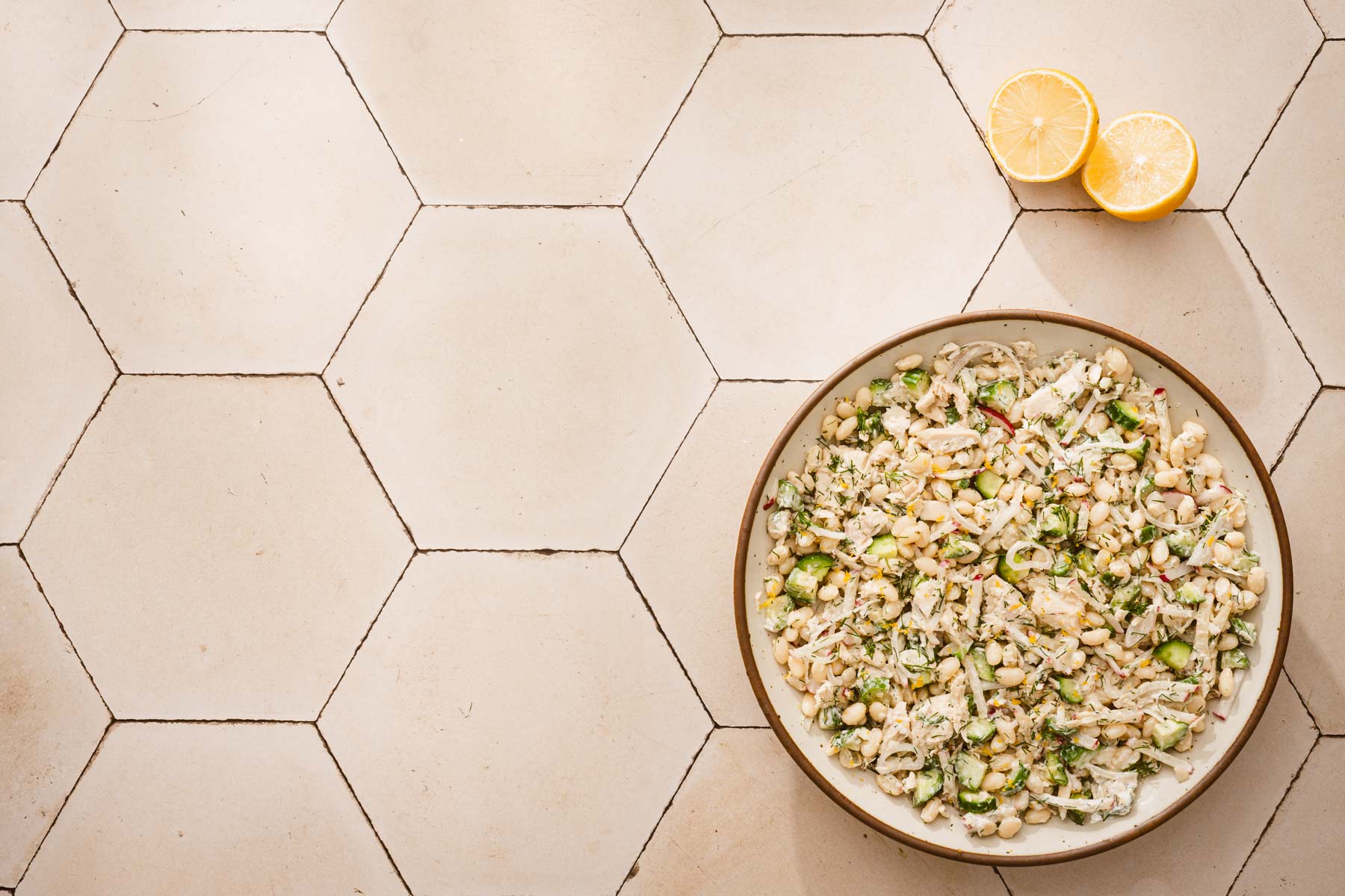 horizontal image of a bowl with whit bean salad