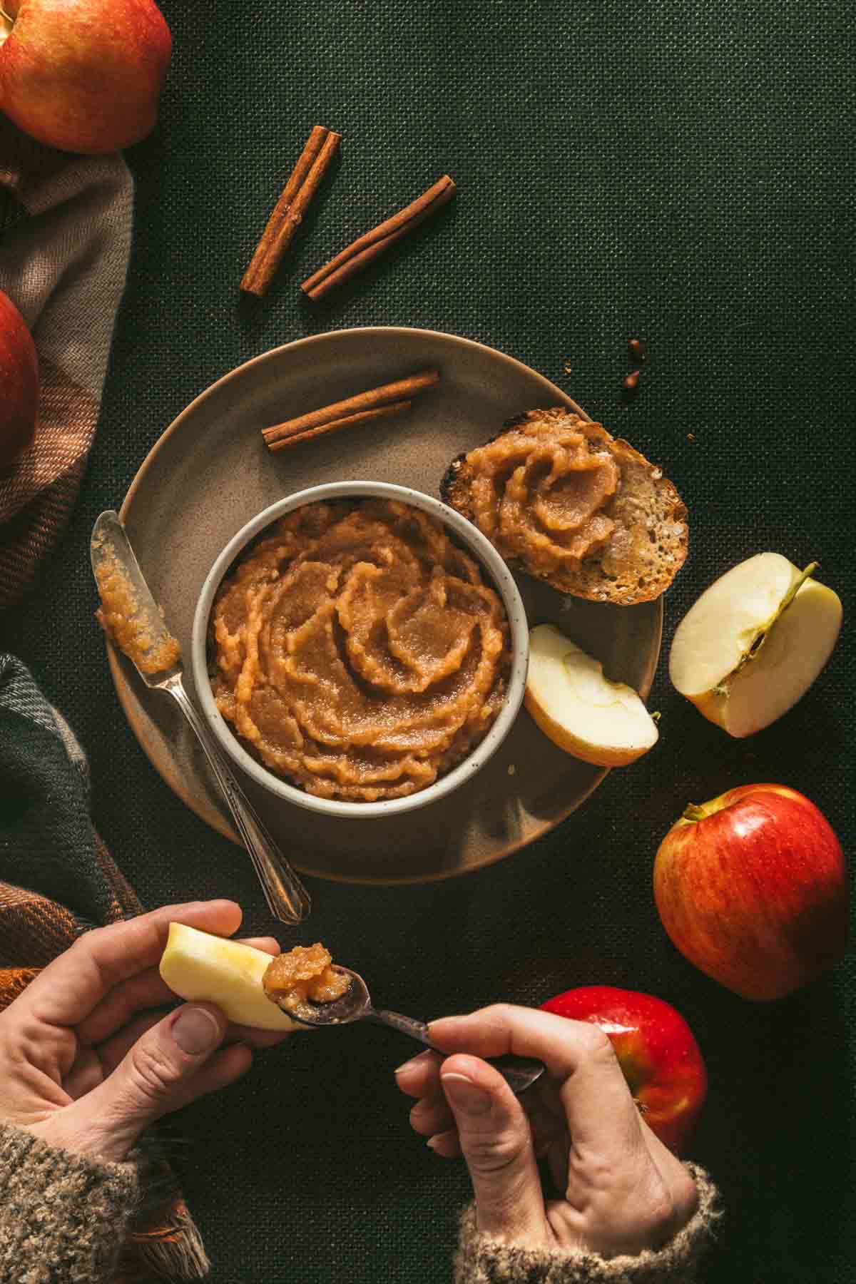 bowl filled with apple butter; cut fresh apples