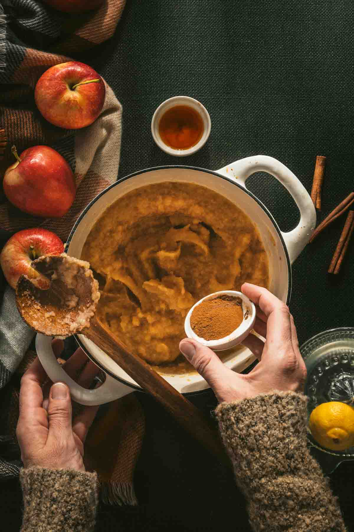 adding spices to apple butter