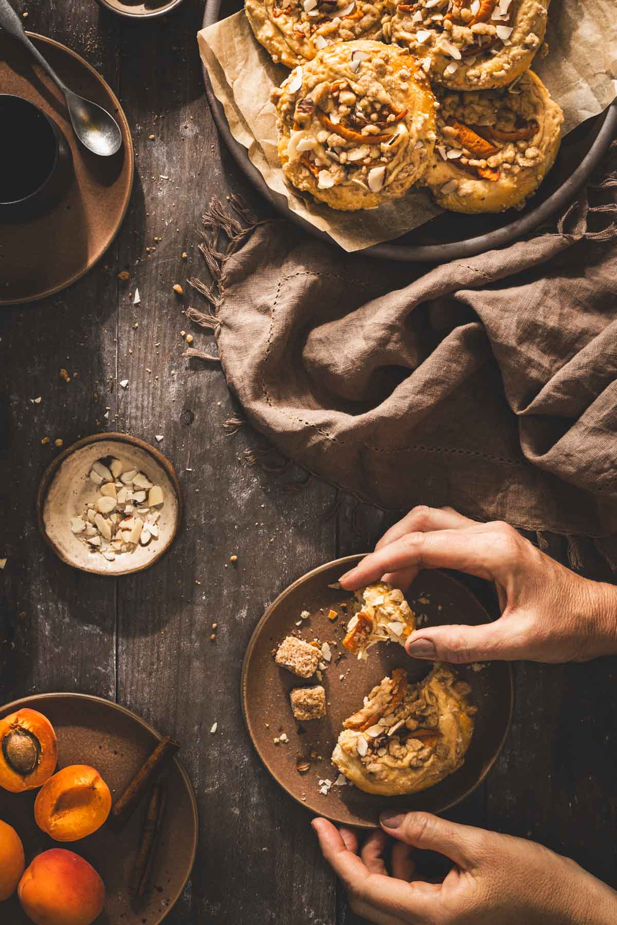 hands in frame holding a sweet bun