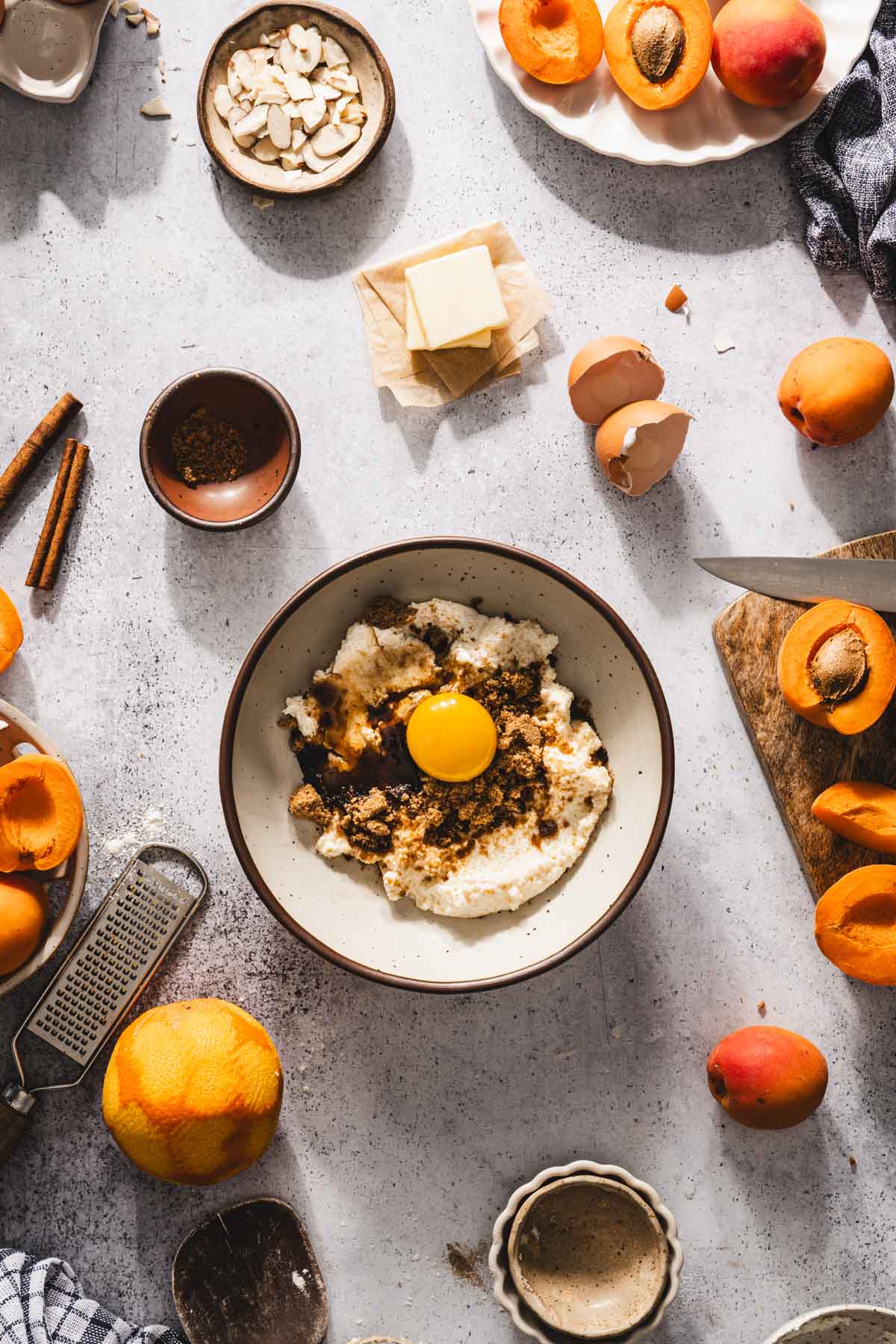 cheese, eggs and aromatics in bowl