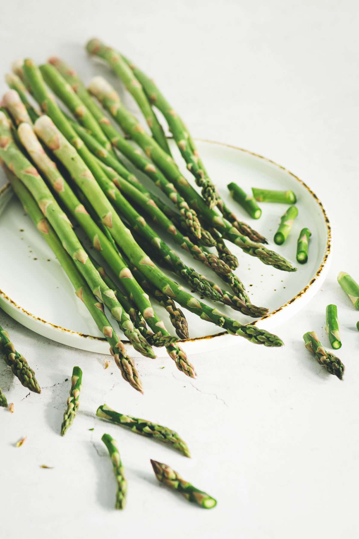 raw asparagus on a plate