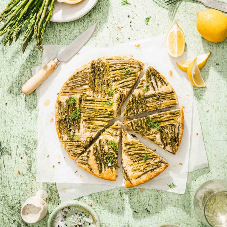 baked upside down cake cut into slices served on a a parchemnt paper,