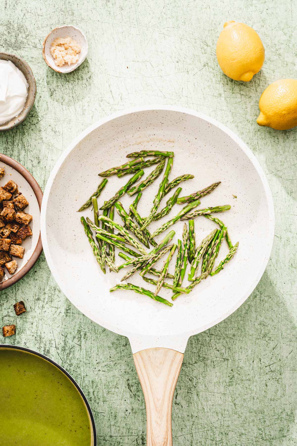 asparagus tips on a skillet