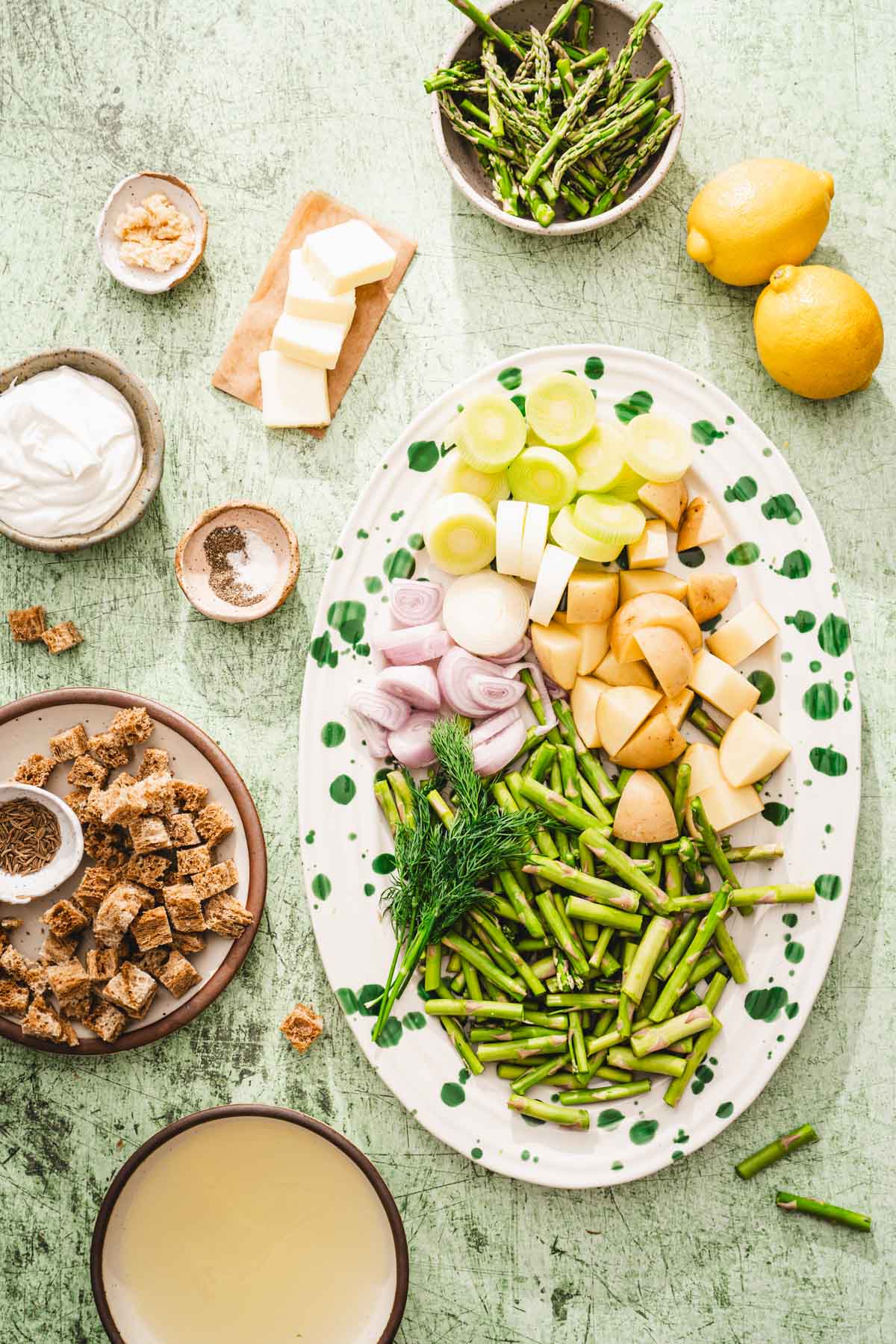 oval platter with chopped up ing to make asparagus soup