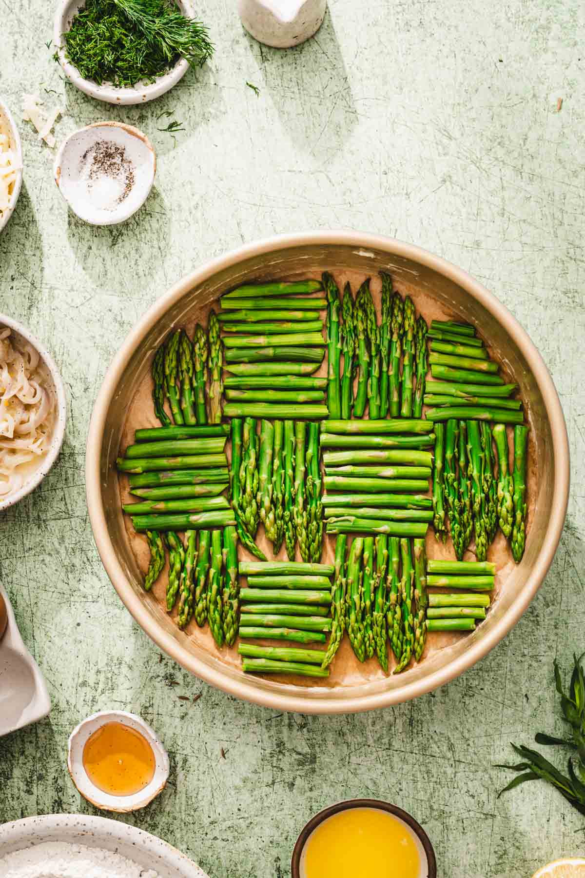 round cakepan with asparagus arranged ina pattern