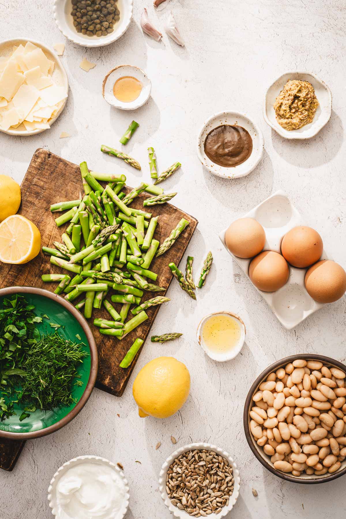 chopped asparagus on a wooden board