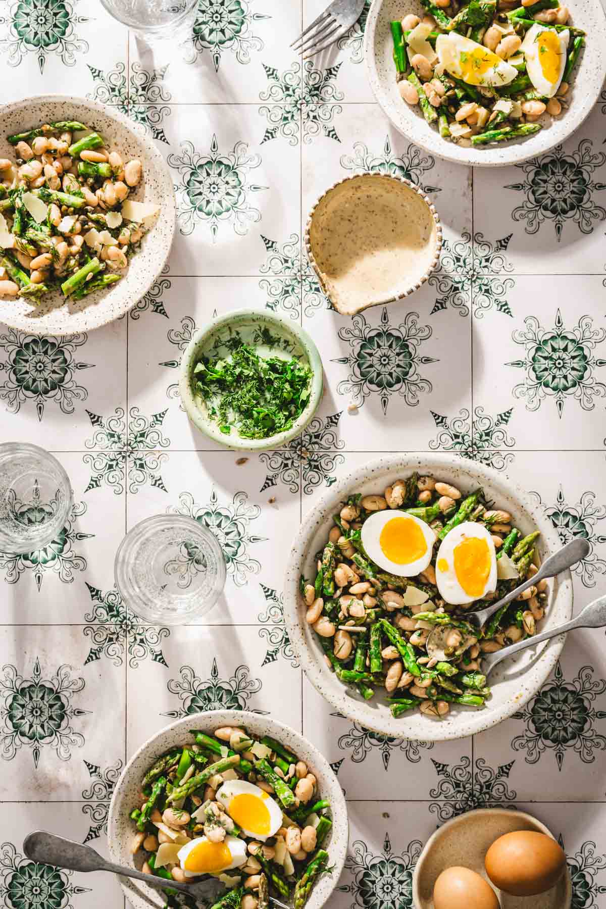 various bowls with the asparagus salad