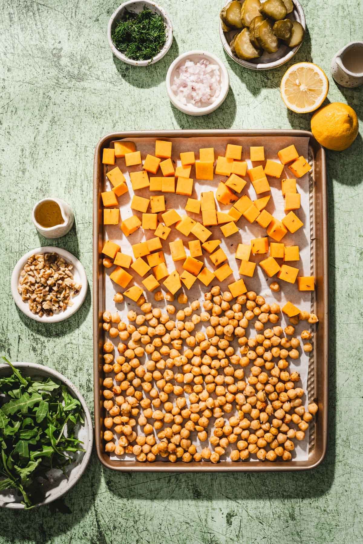 baking sheet with cut up squash and chickpeas