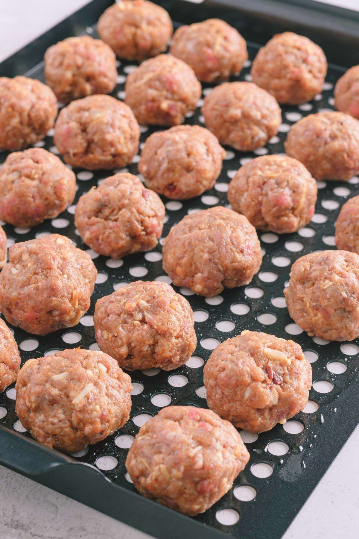 close up of raw bbq meatballs