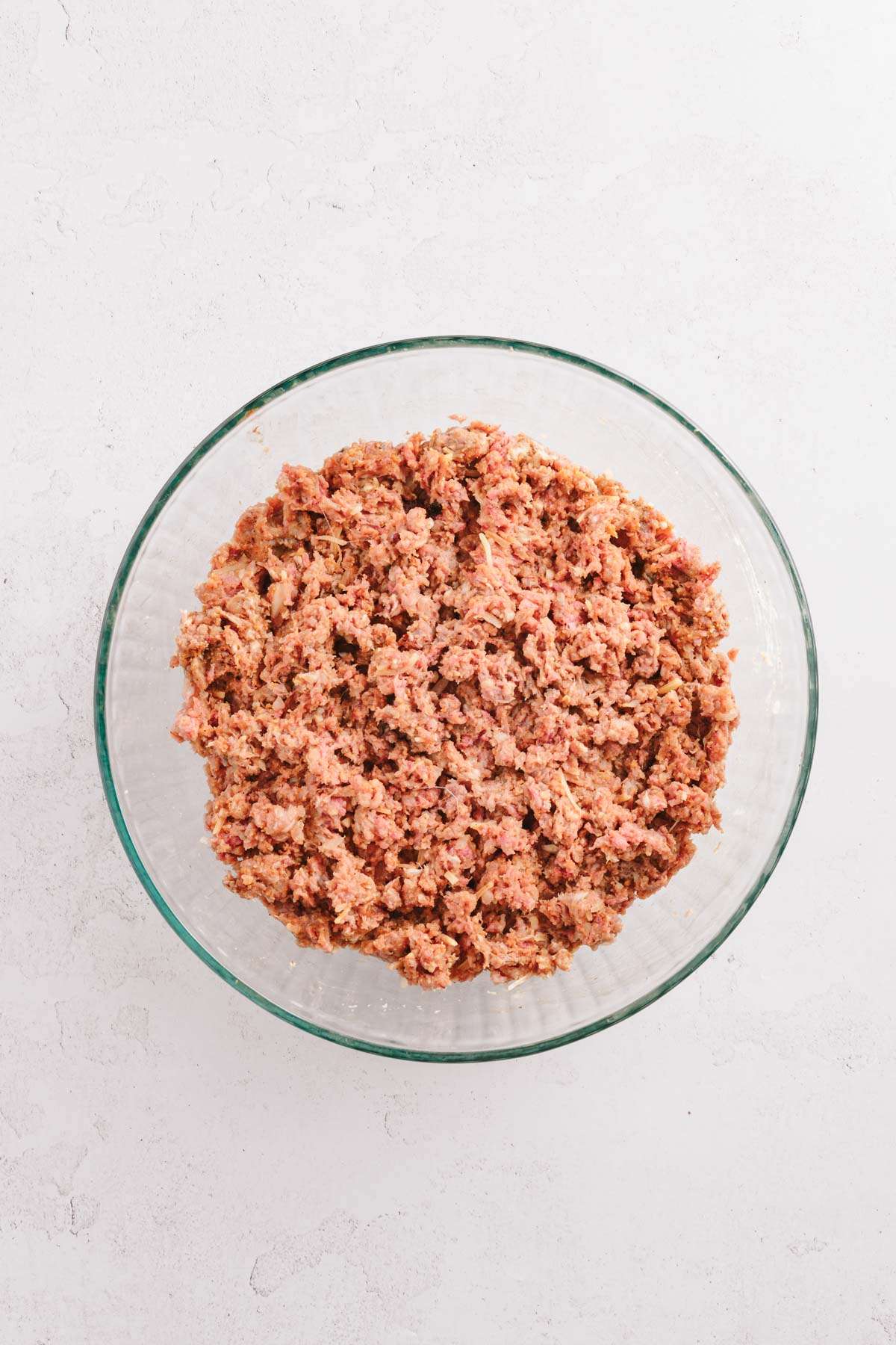 ingredients for bbq meatballs all mixed in the bowl