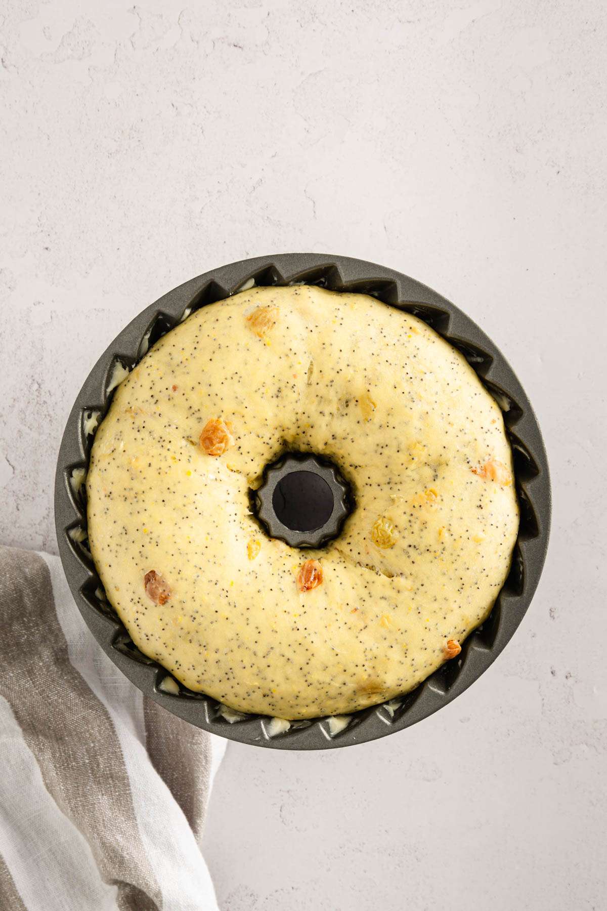 babka dough risen in a Bundt pan