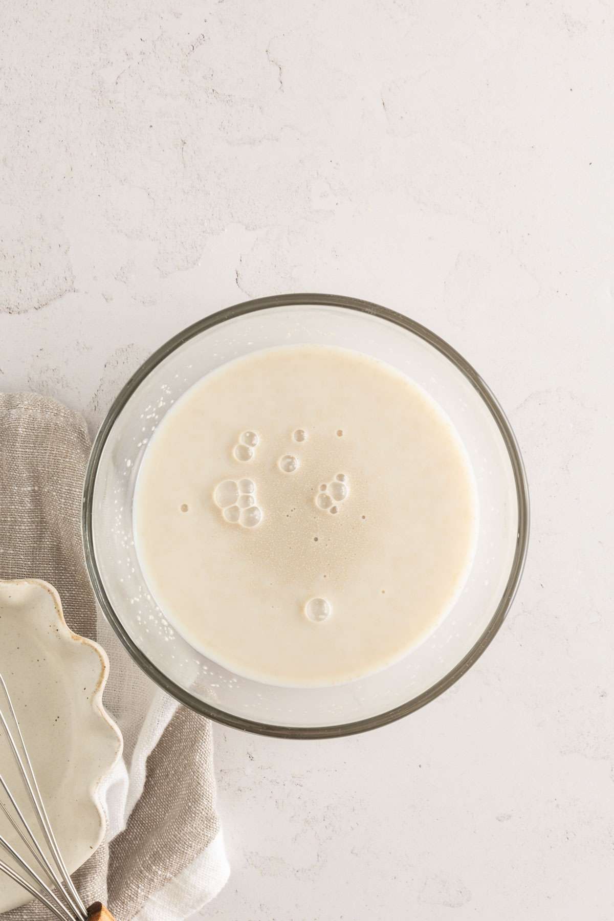 milk and yeast in a bowl