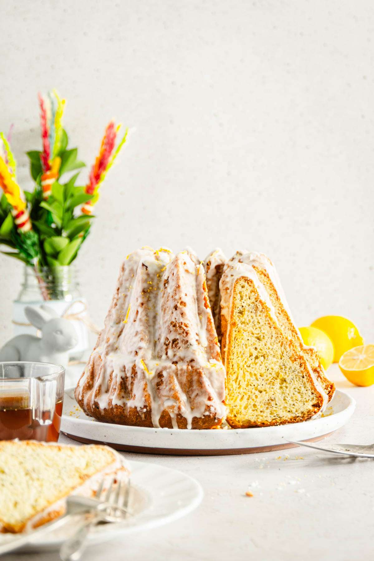 Babka, slices cut out, front view, Easter Palms in a vase in the background