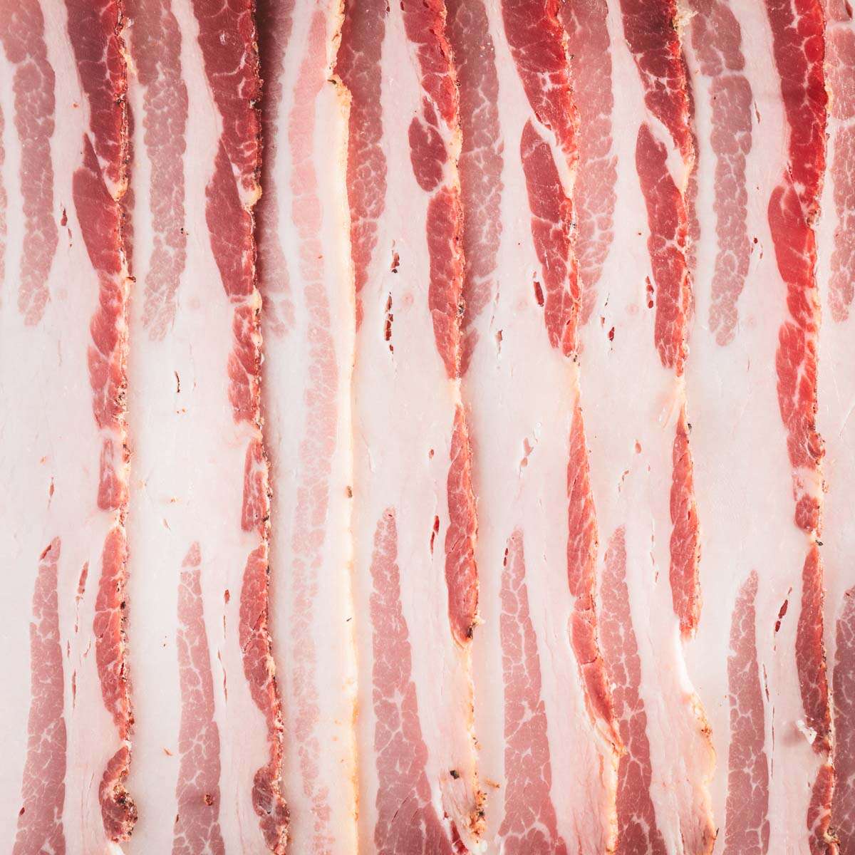 close up of bacon slices, raw