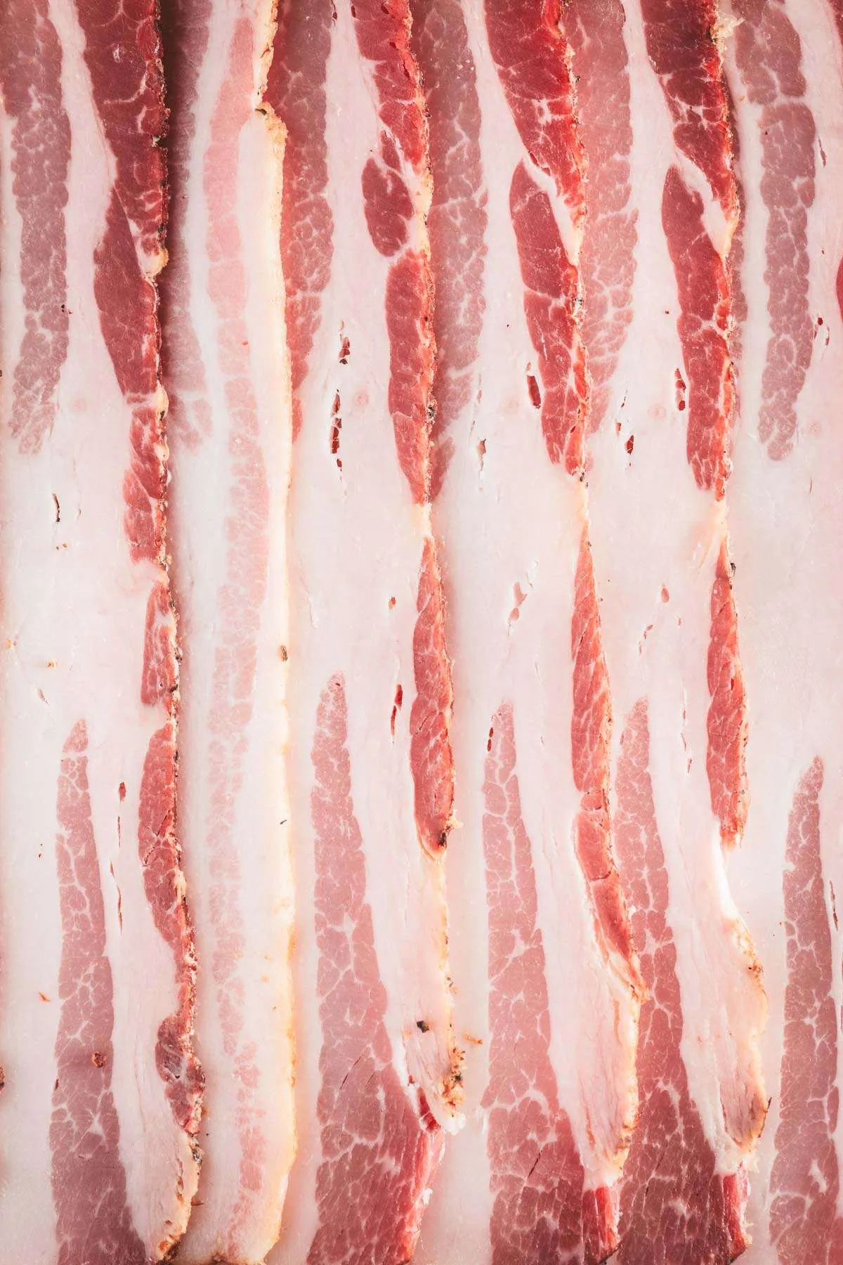 close up of bacon slices, raw