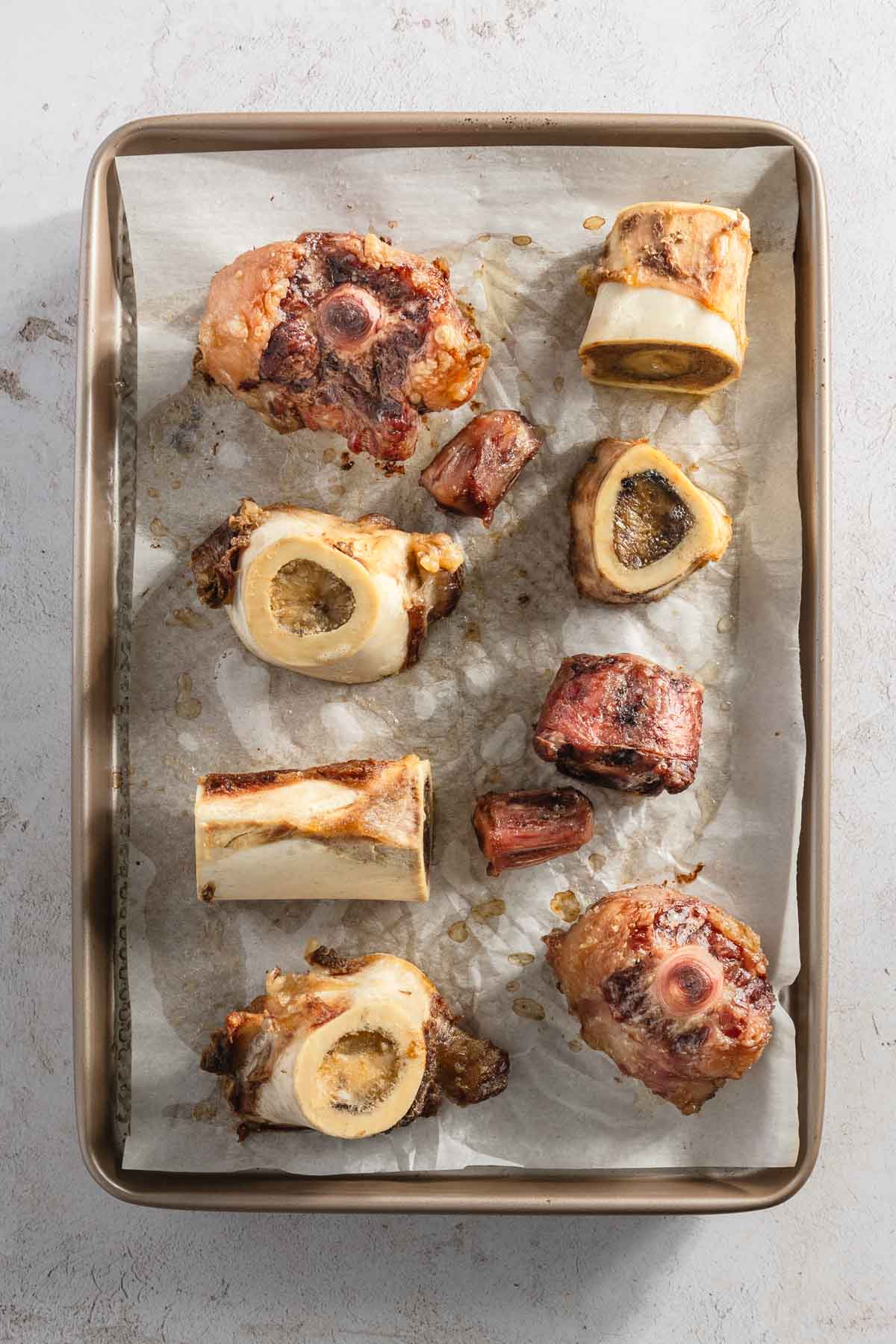 roasted boiled beef bones on a baking sheet