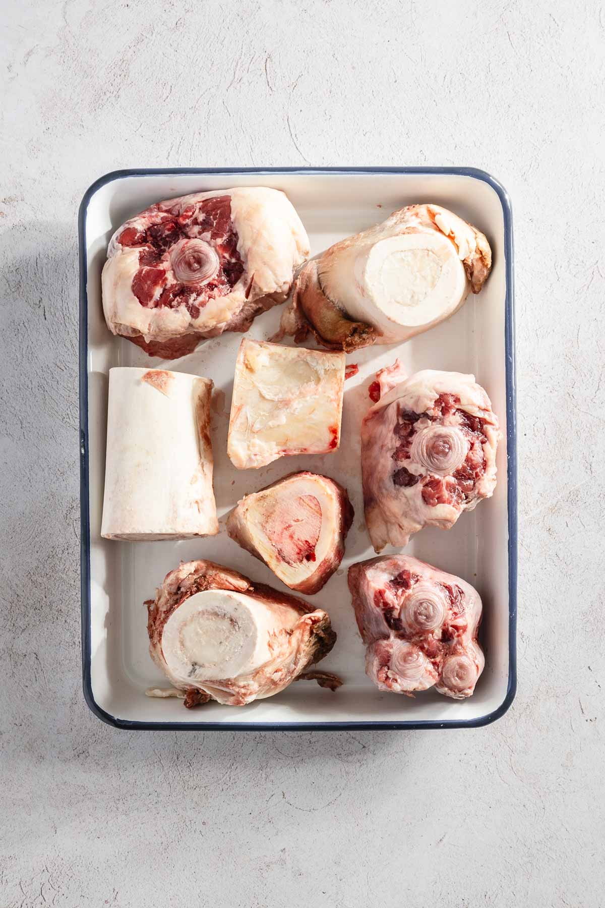 beef bones on a baking sheet