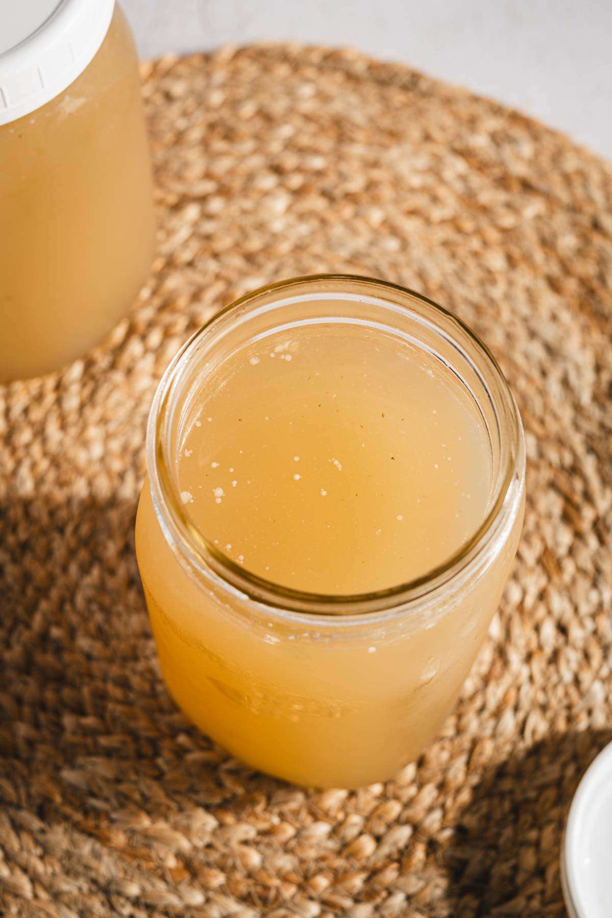 beef bone broth in a mason jar, top view