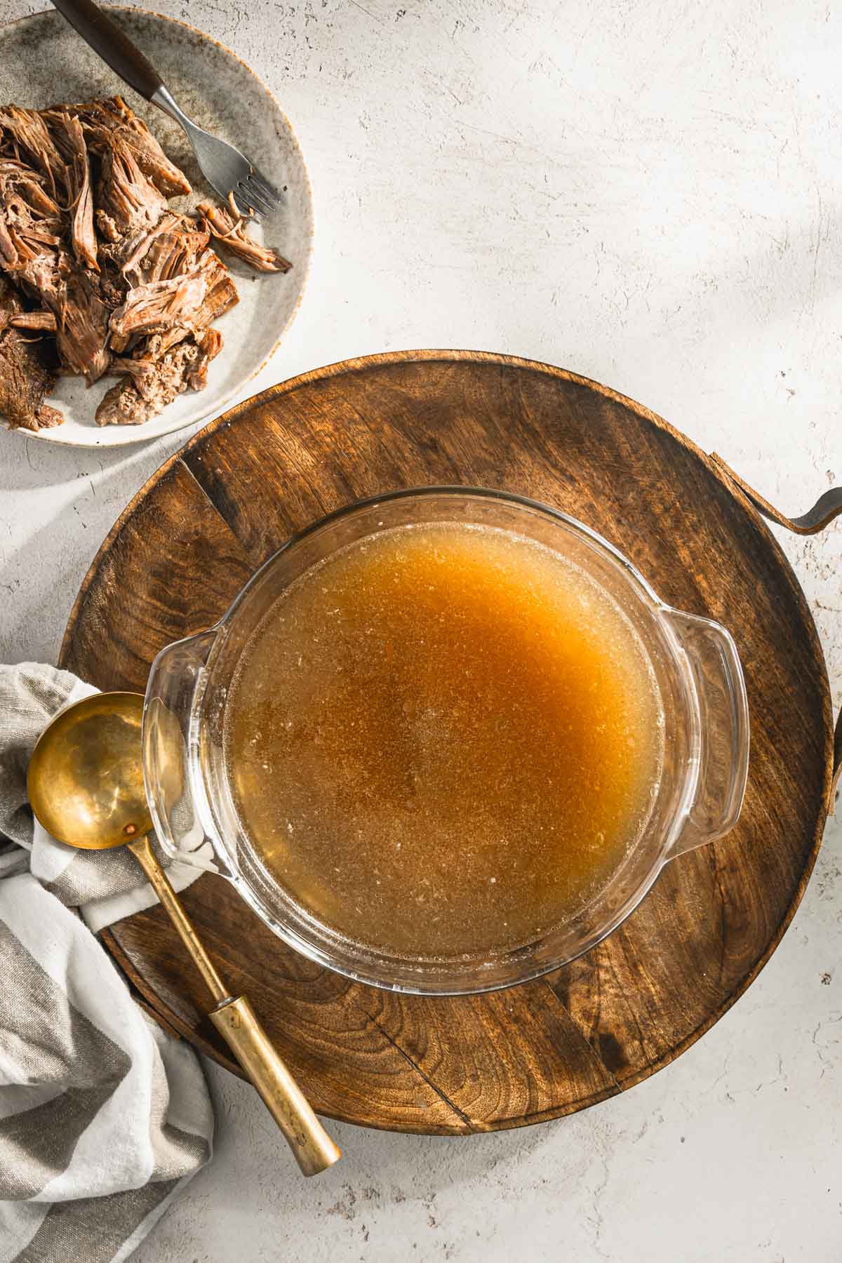 made beef broth in a glass serving dish