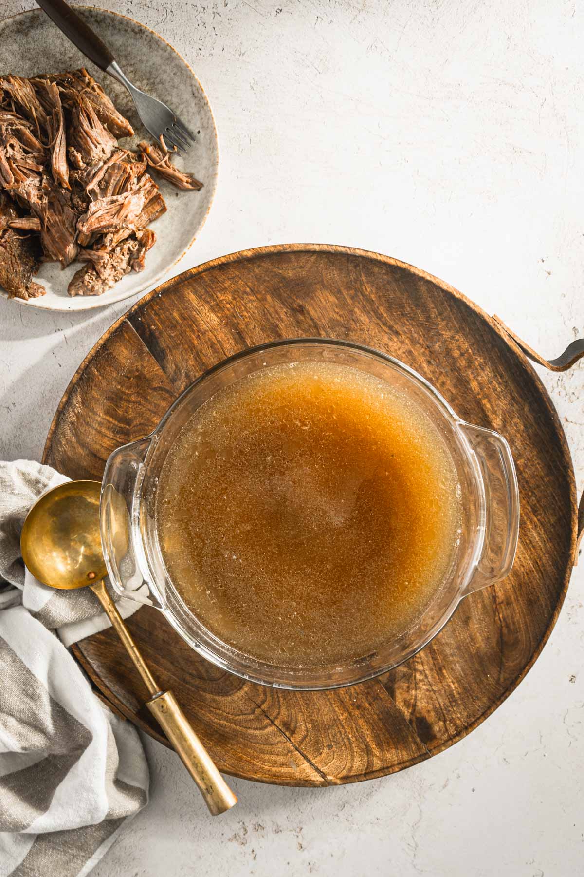 made beef broth in a glass serving dish