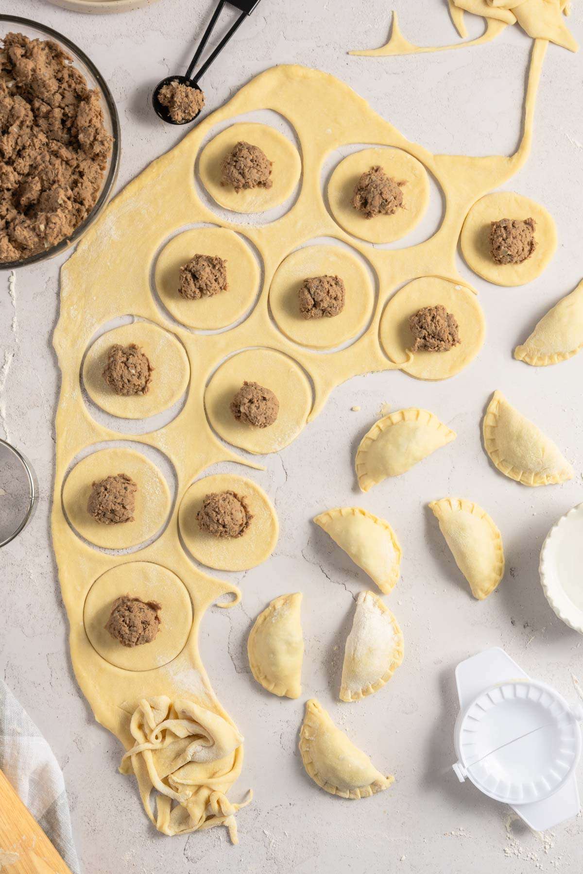 pierogi dough rolled out on a flat surface