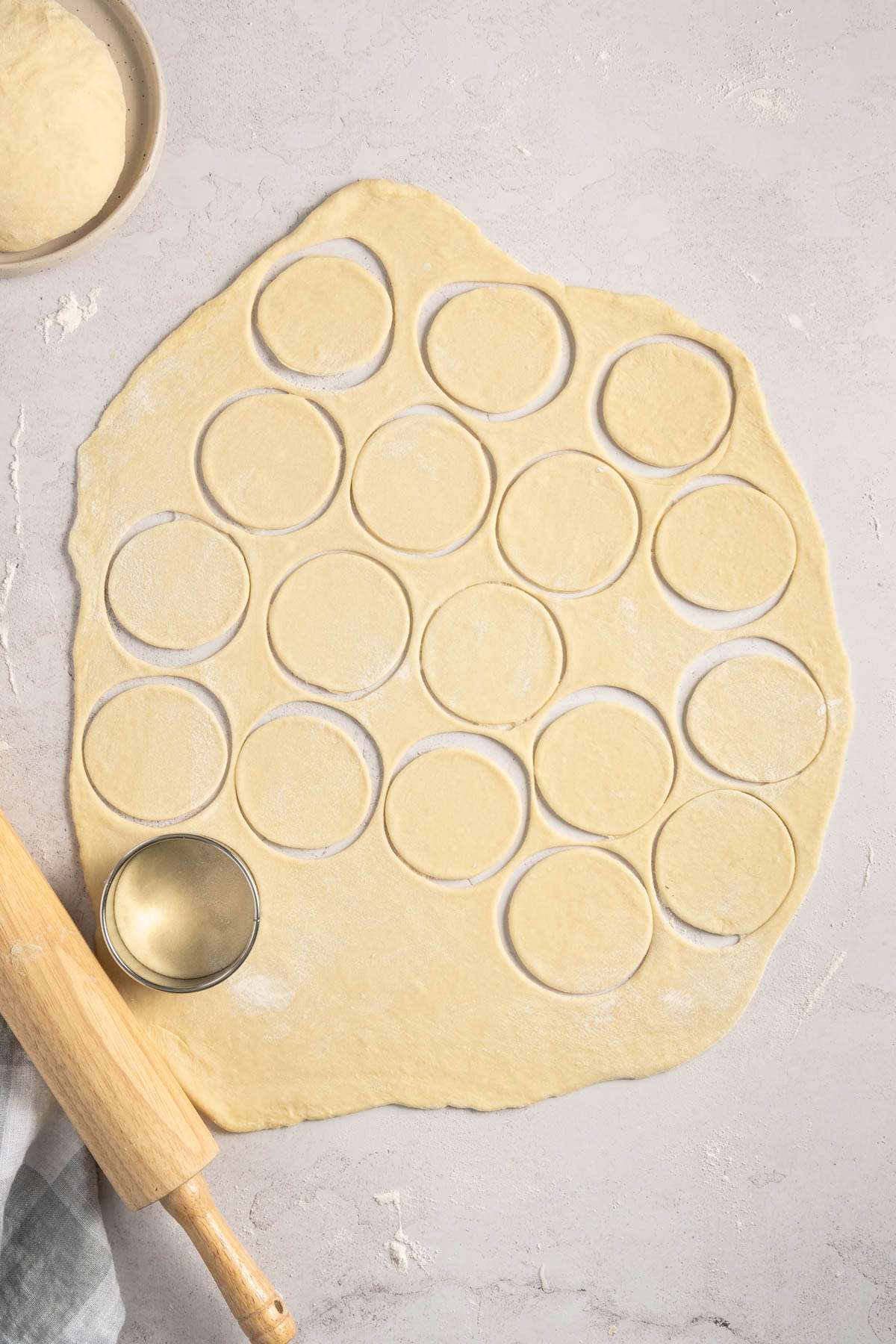 pierogi dough rolled out on a flat surface