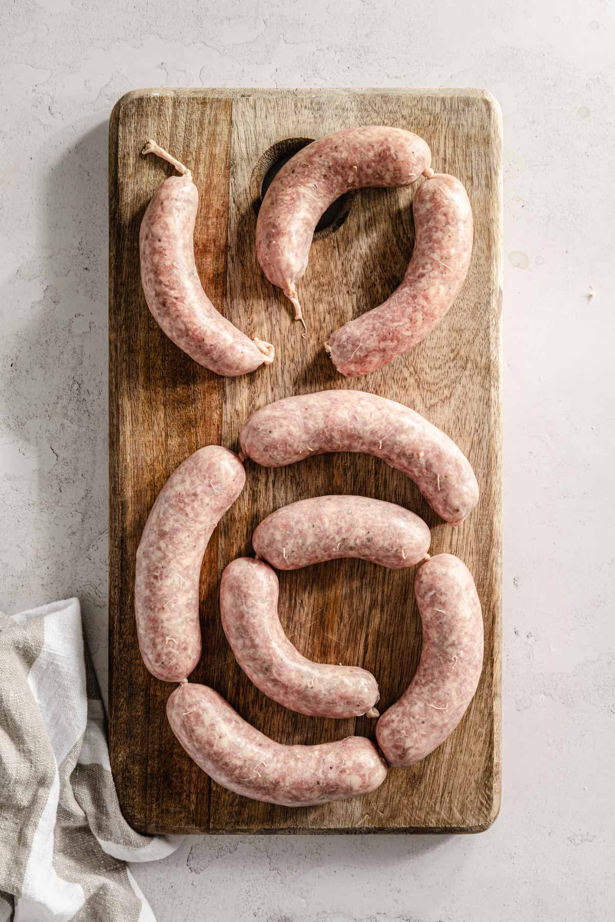 sausage links on a wooden board