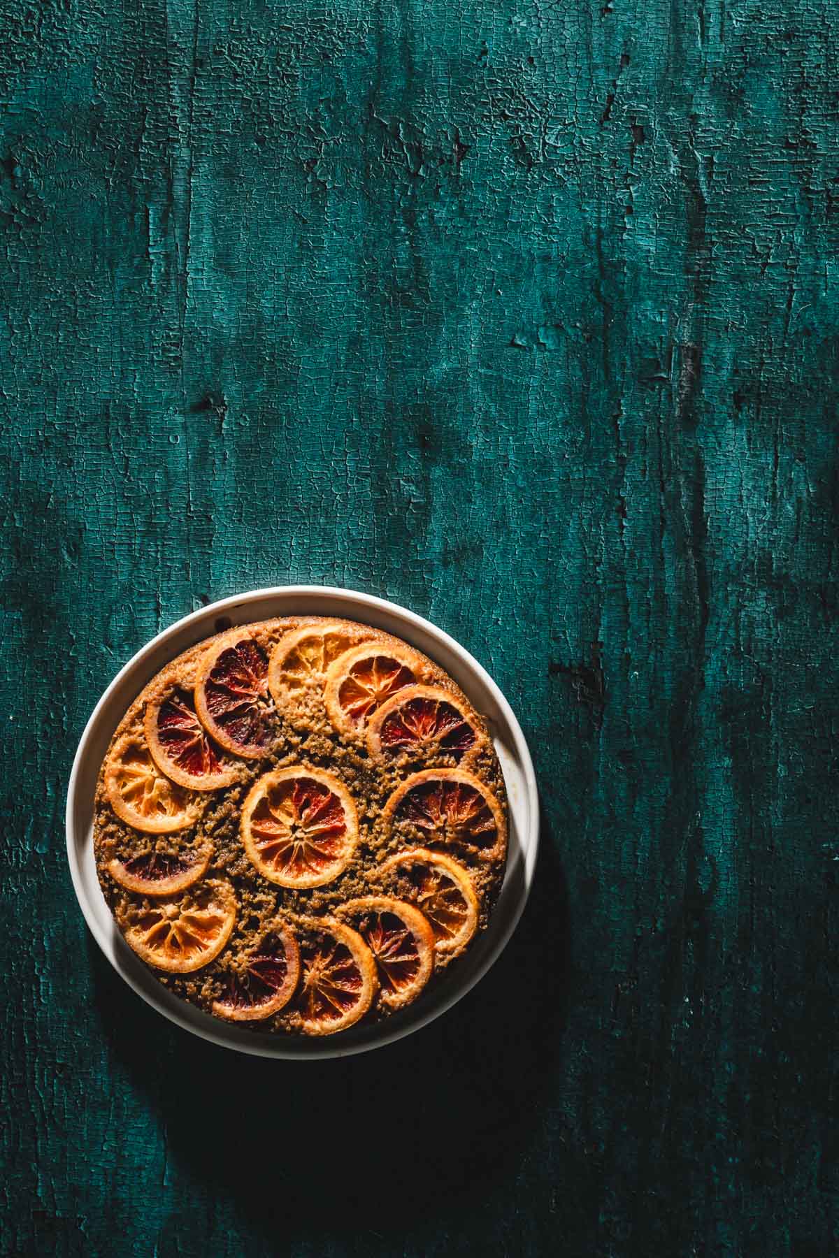 baked cake on a tal backdrop