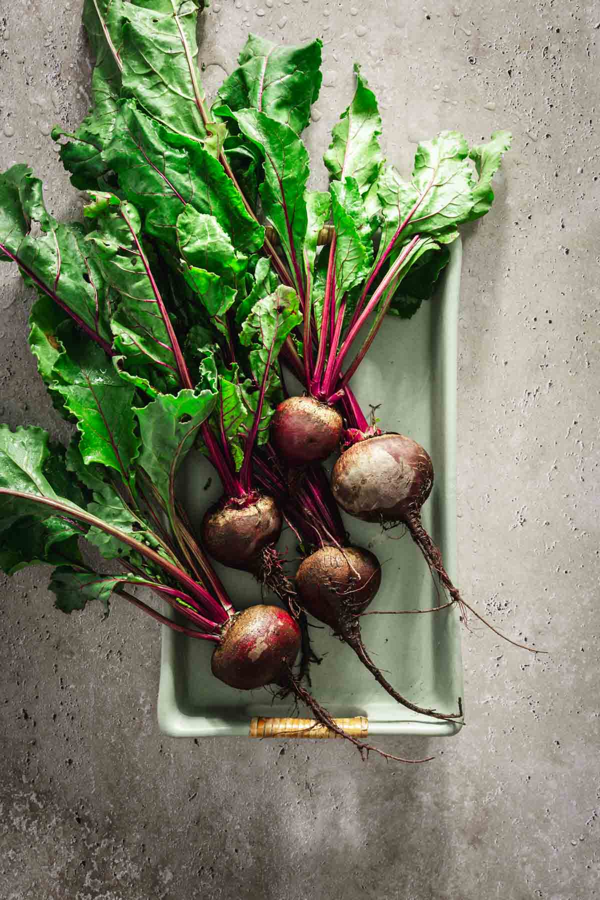 whole beets in a glass tray