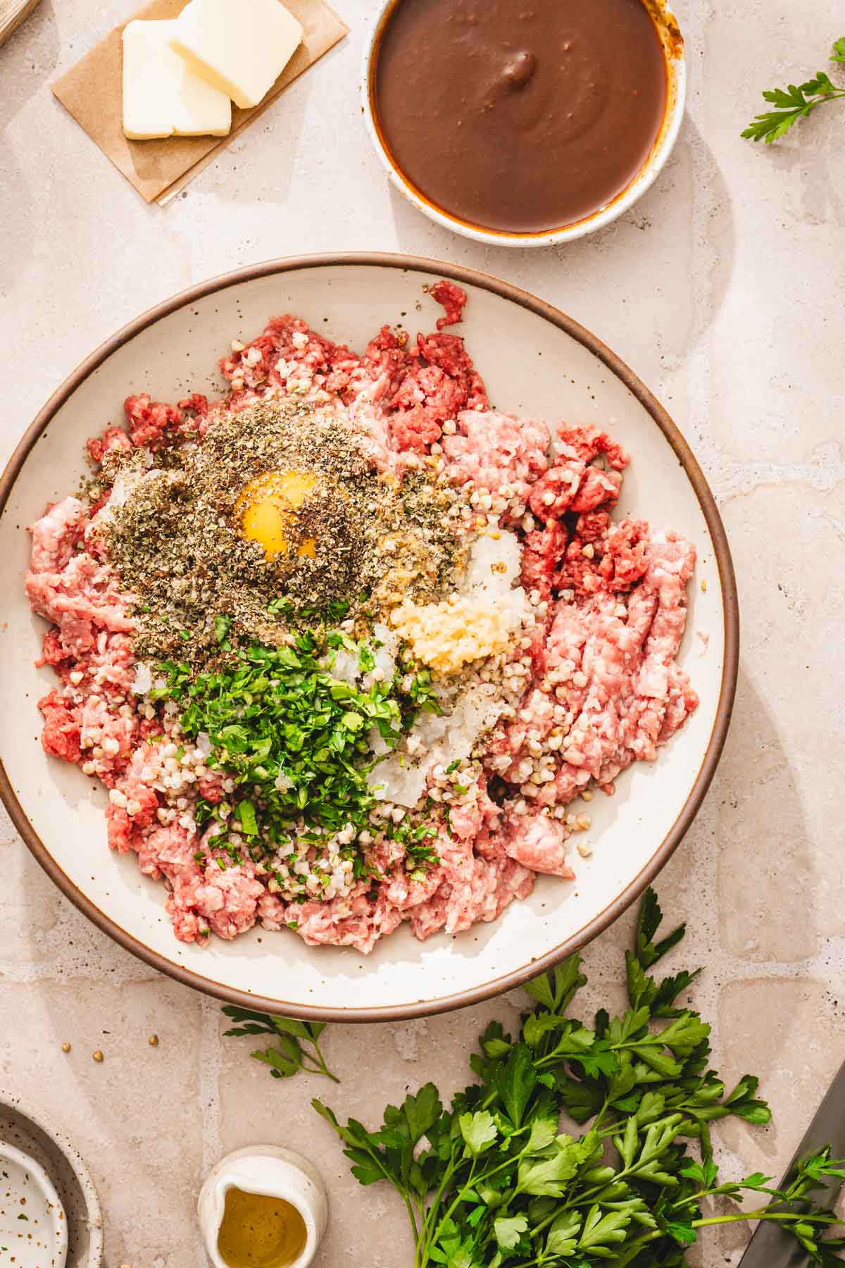 large bowl with all ing added to the ground meat