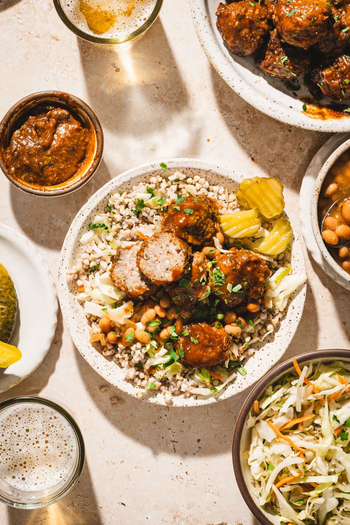 close up of a bowl with meatballs served over buckwheat