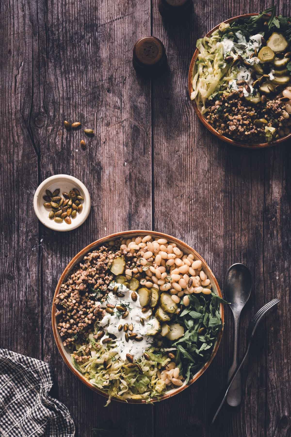 various bowls with buckwheat bean bowl in a serving bowl