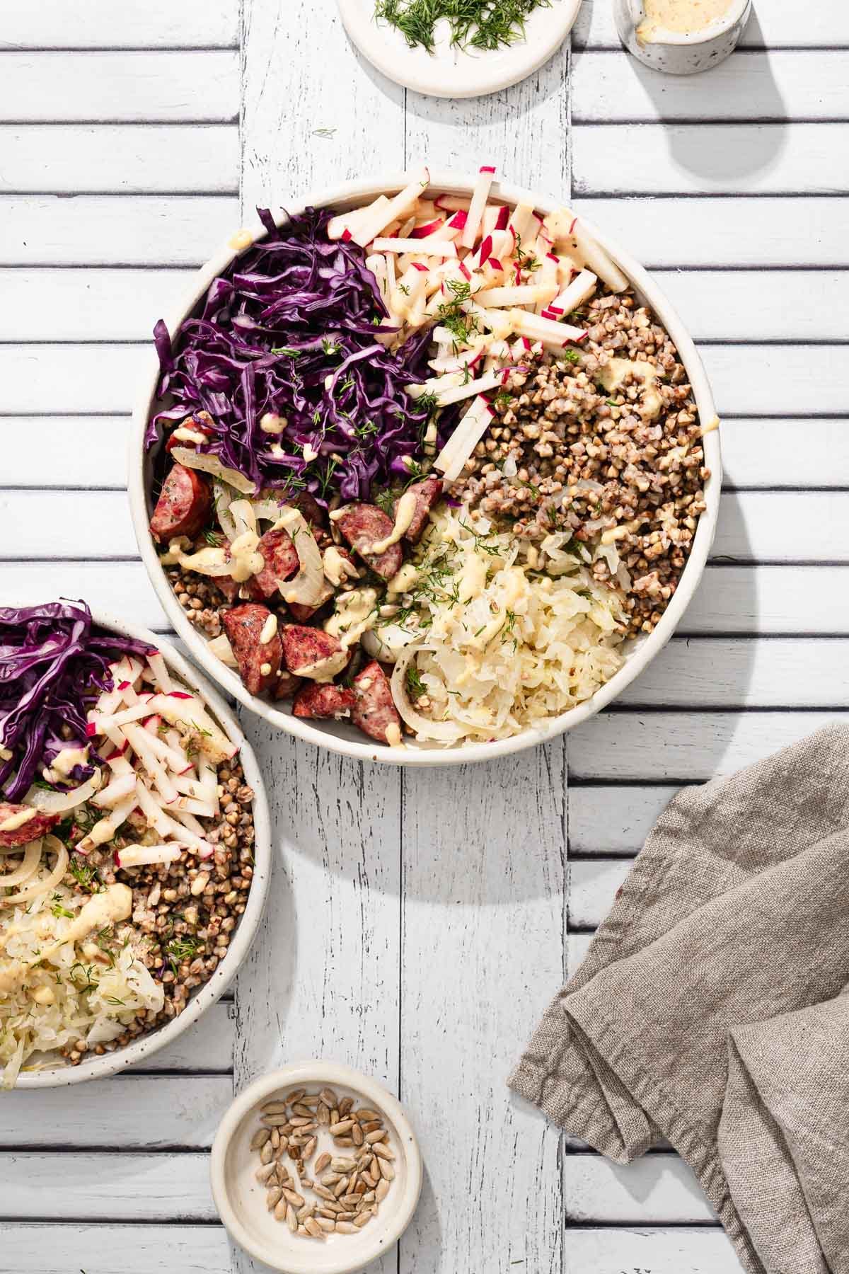 two buckwheat bowls, napkin, sunflower seeds