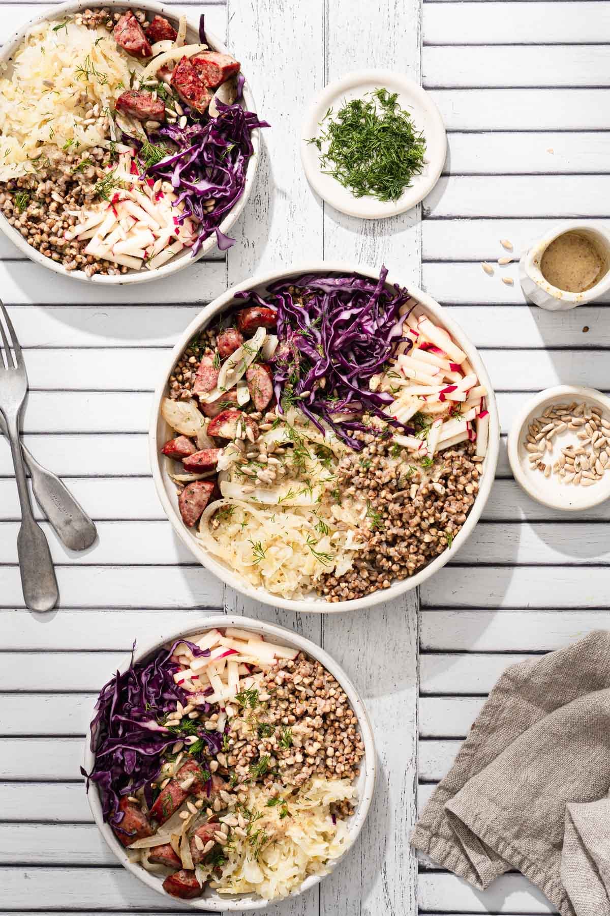 buckwheat bowls served , utensils, napkin, dish with fresh dill