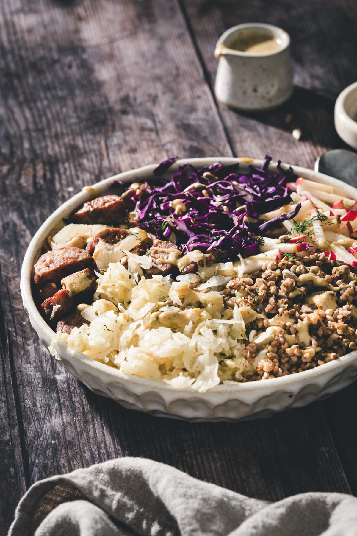 side view of a buckwheat bowl, dish with dressing