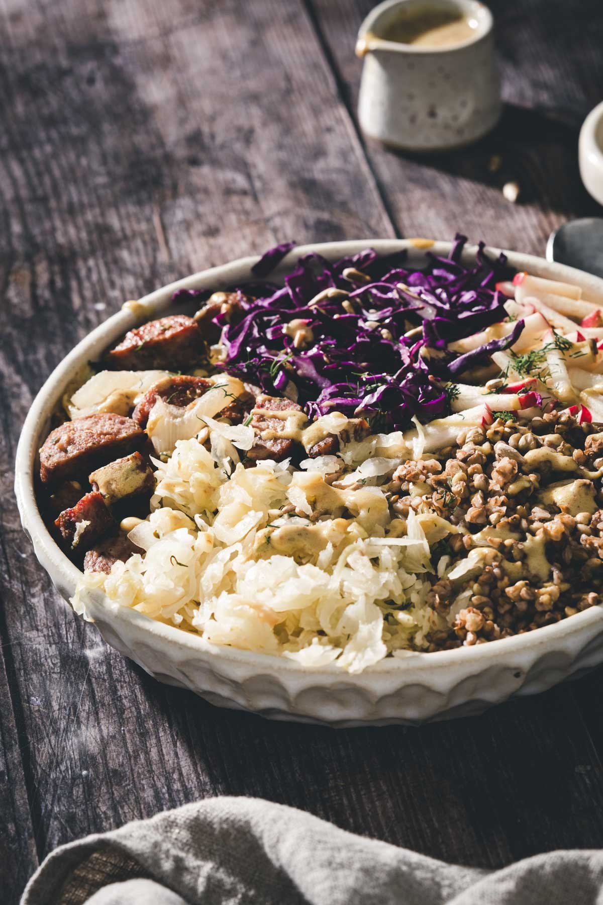 side view of a buckwheat bowl, dish with dressing