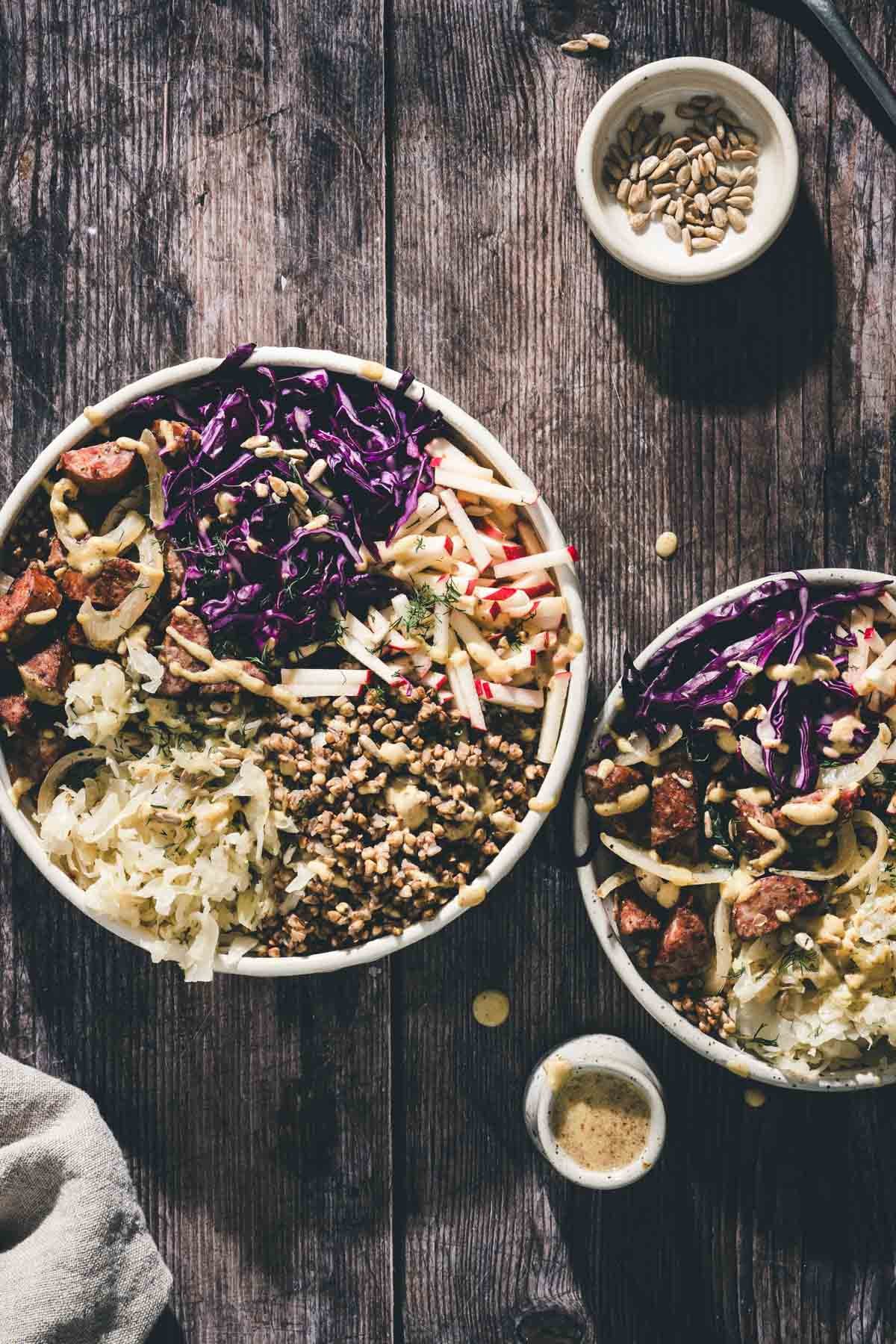 two buckwheat bowls, dish with dressing