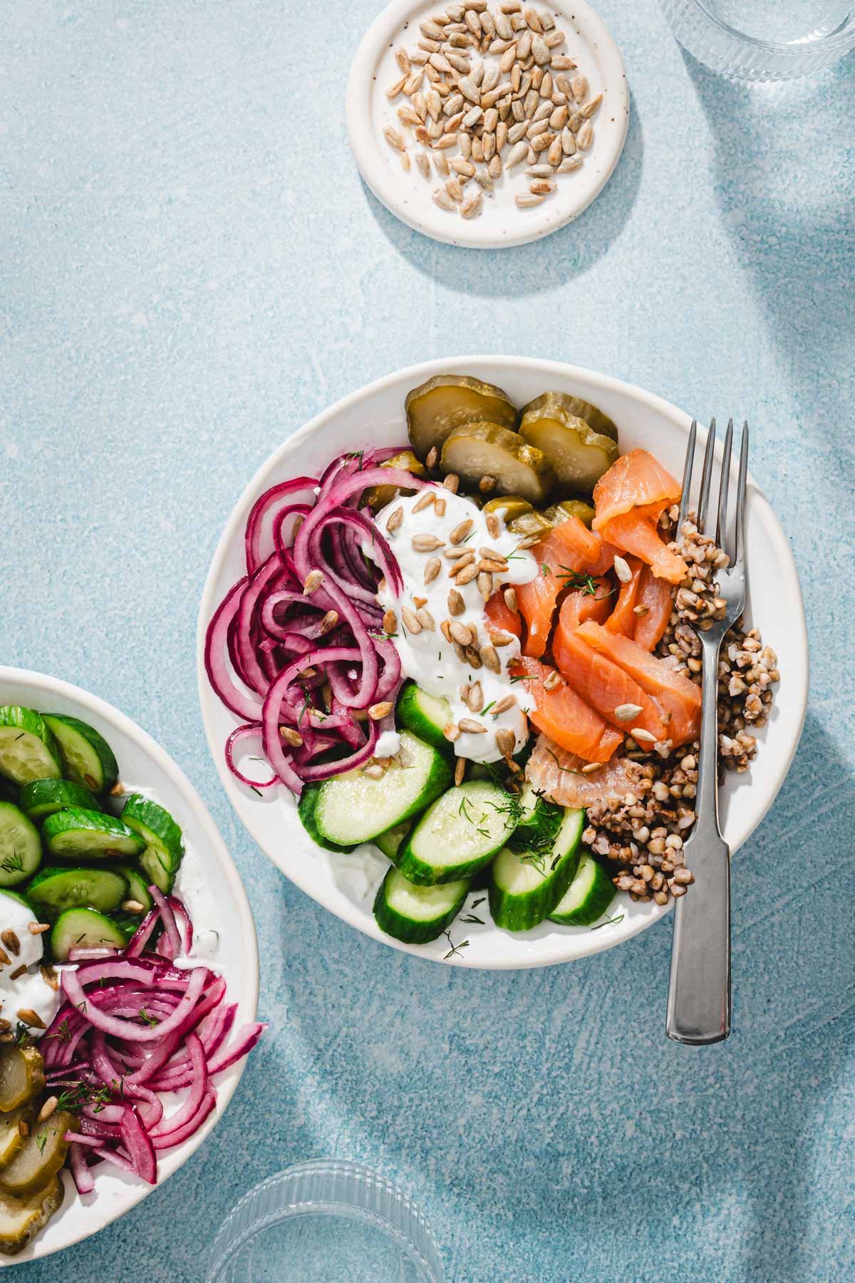 salmon buckwheat bowls and veggies; glasses with water