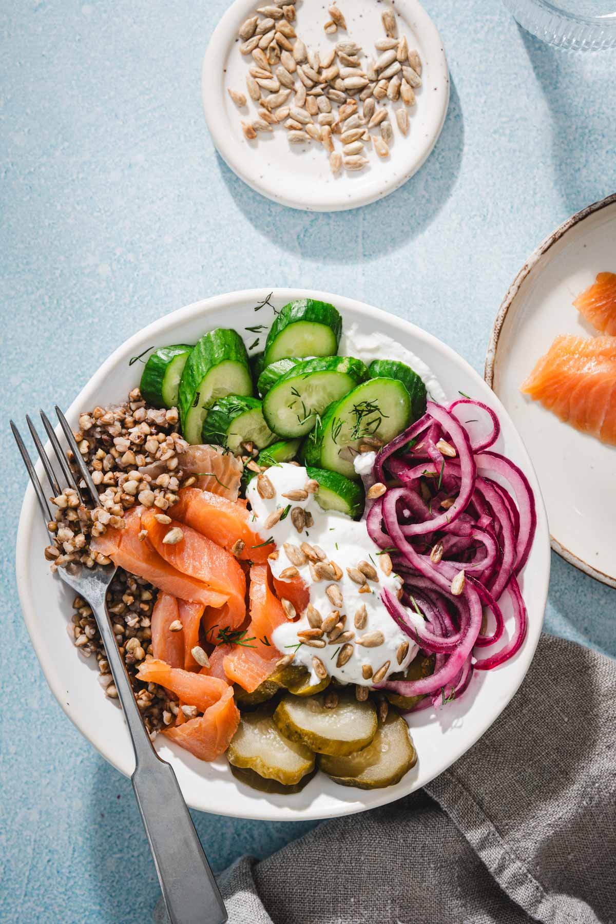 top view of salmon buckwheat bowl and veggies