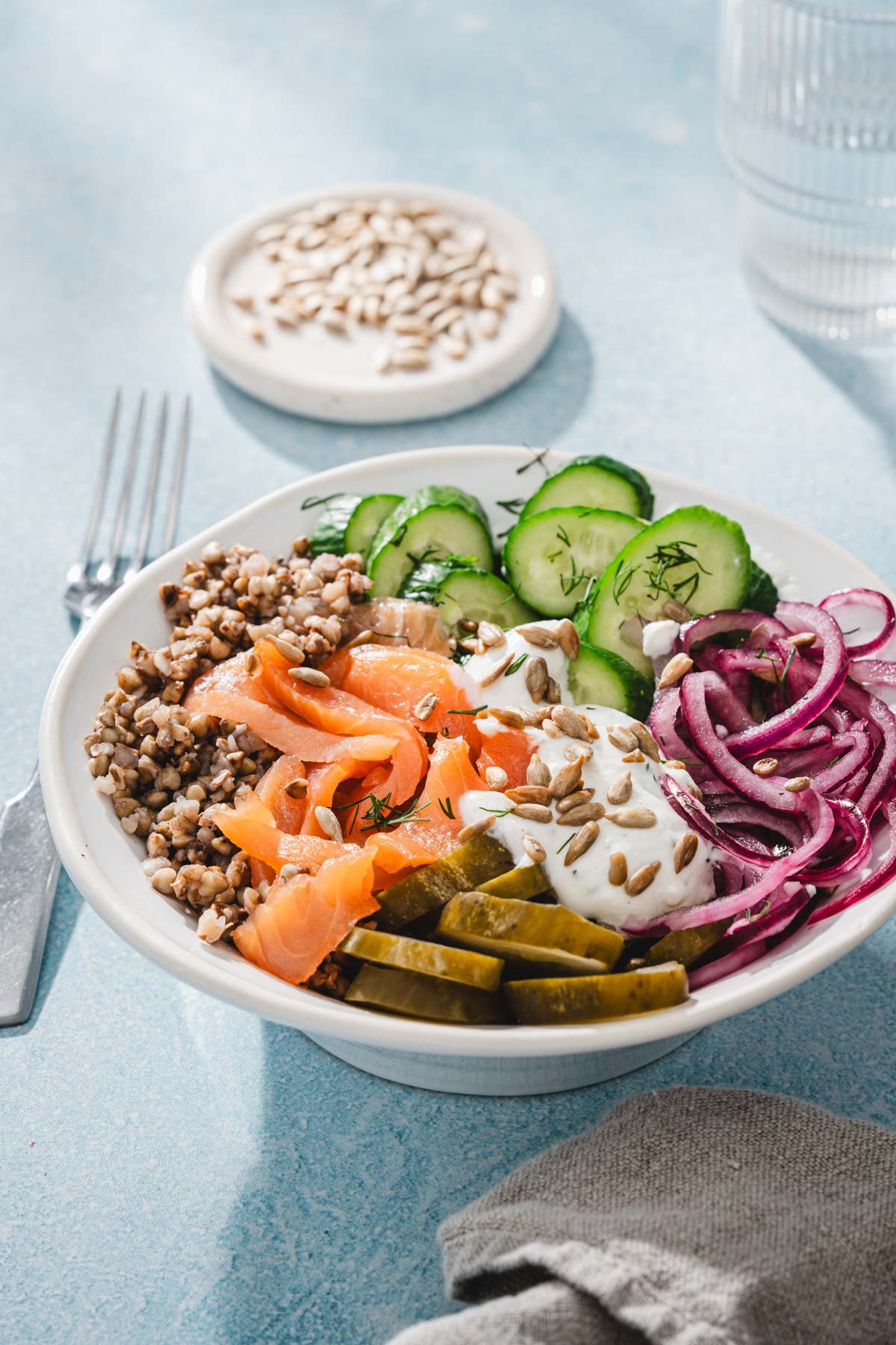 side view of salmon buckwheat bowl and veggies