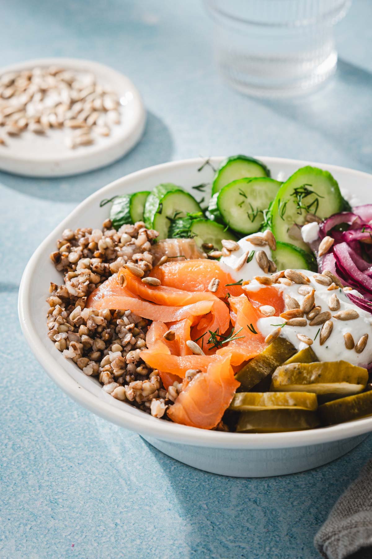side view of salmon buckwheat bowl and veggies