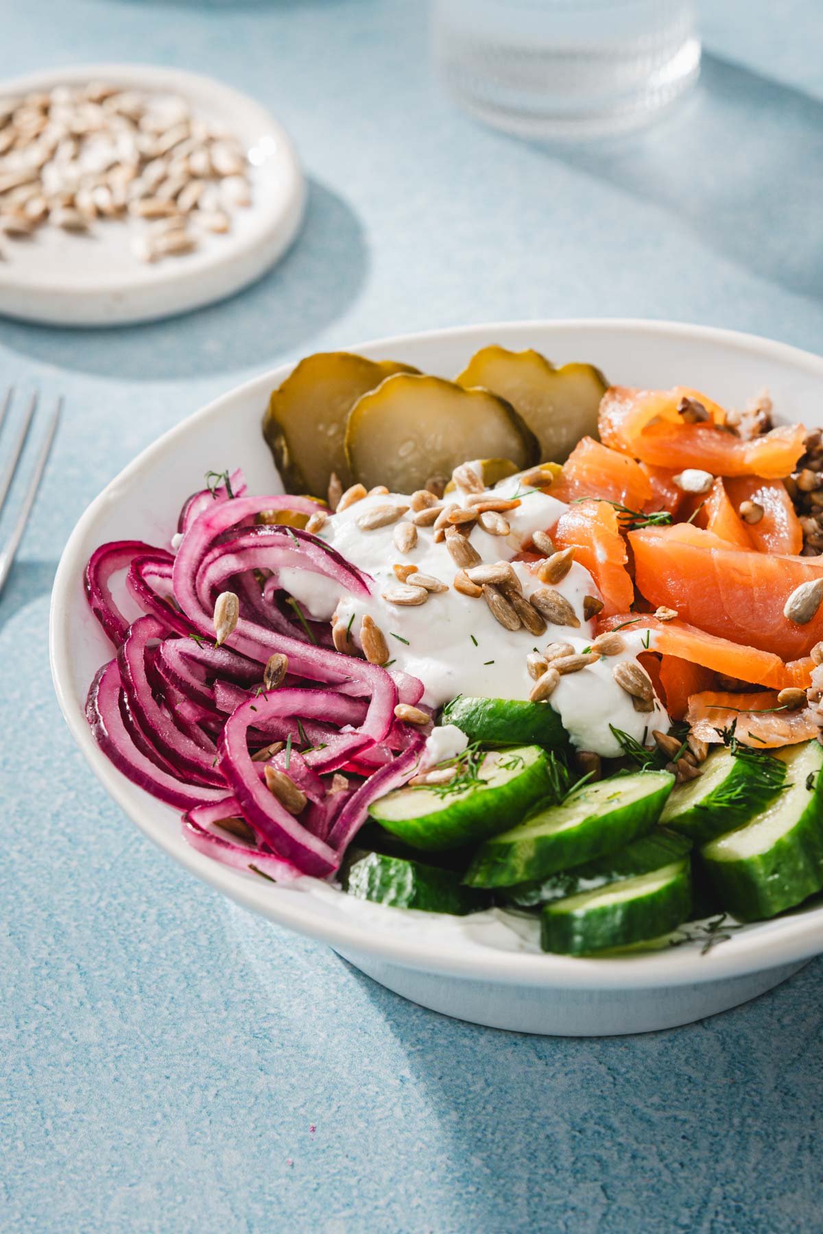 side view of salmon buckwheat bowl and veggies
