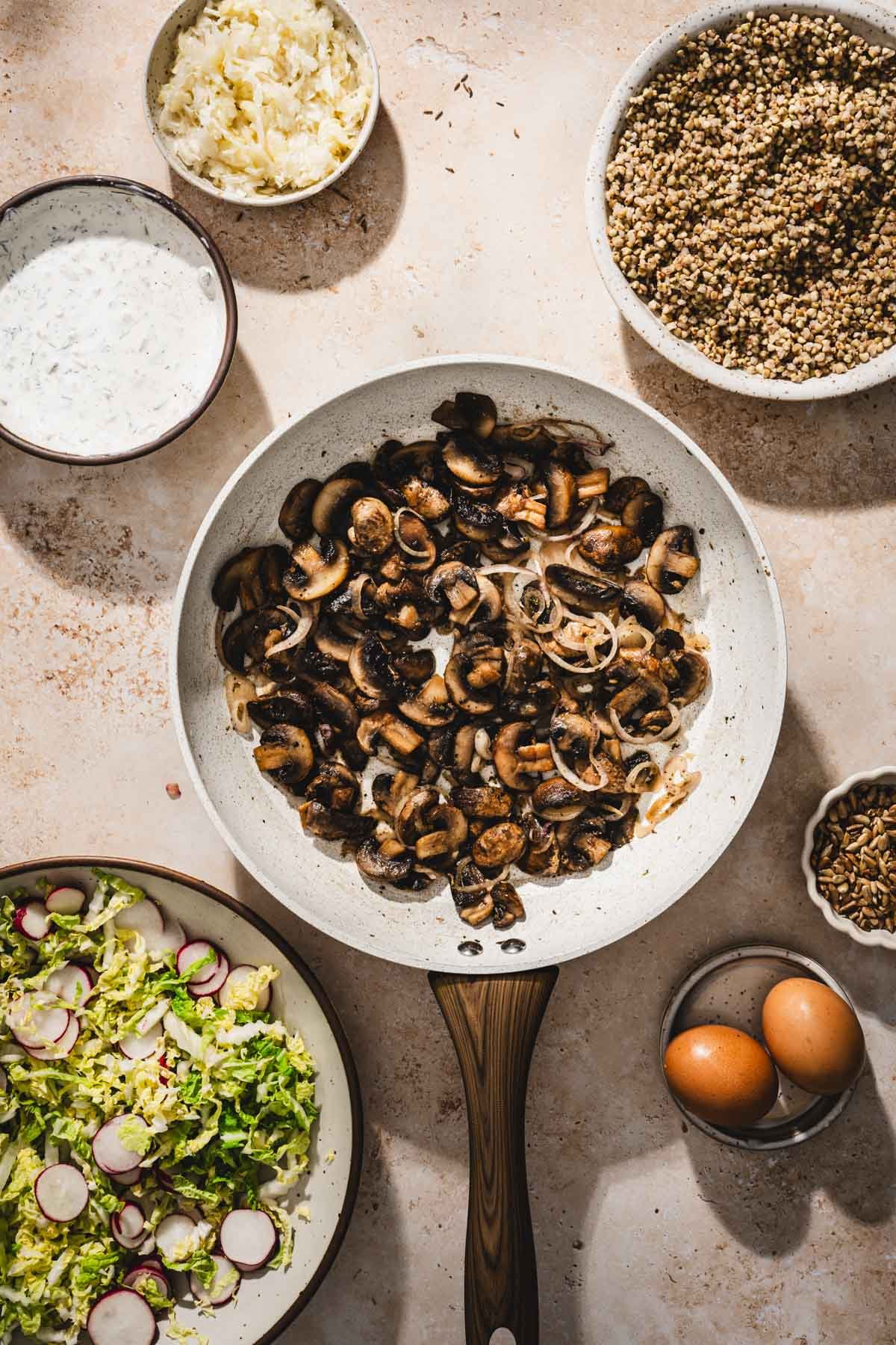 cooked mushroom in a skillet and dressing made