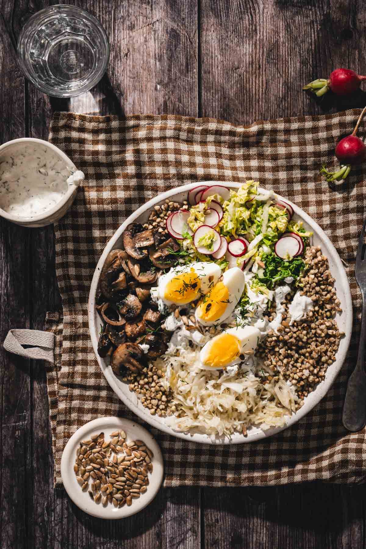 serving bowl with mushroom and buckwheat on a linen napkin
