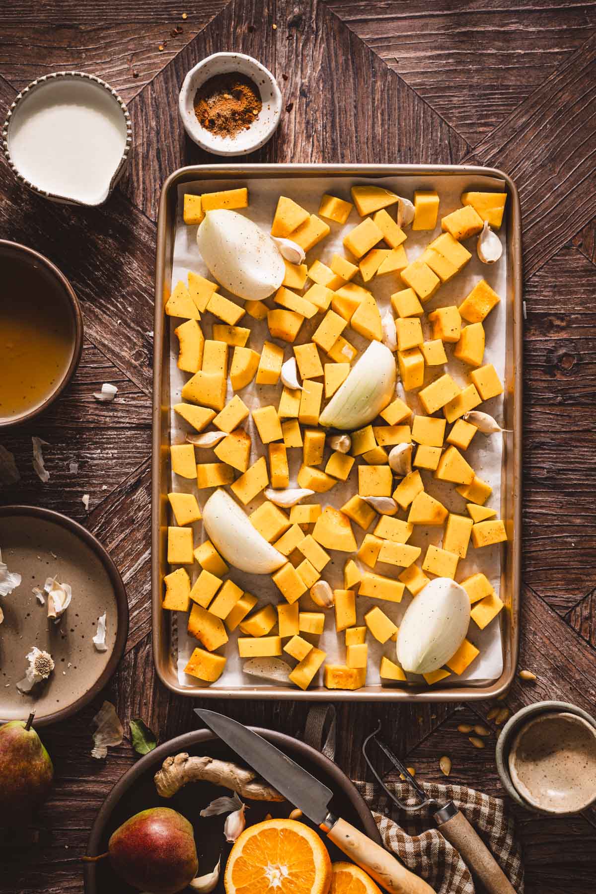 squash and onions on the baking sheet