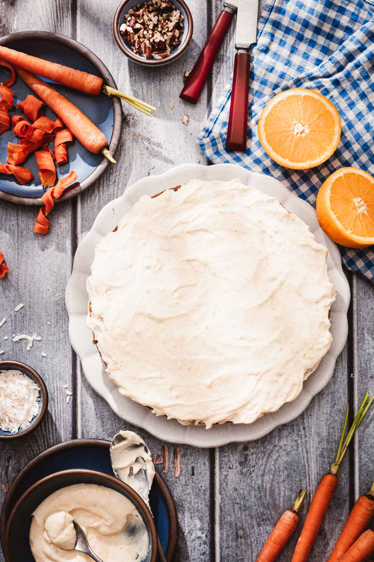 baked cake on a plate, other plates and bowls around