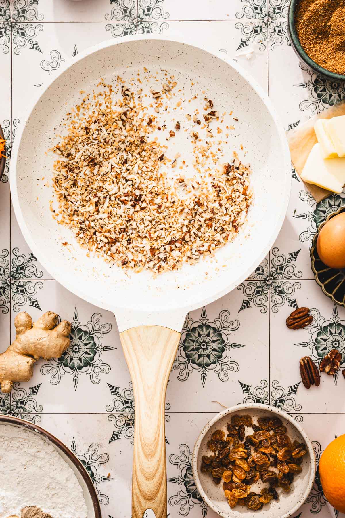 skillet with roasted nuts and coconut