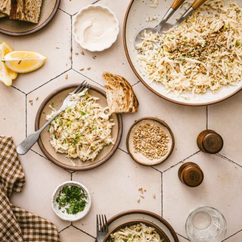 various plats with the salad, frsh lemon, large bowl with the salad